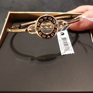 Gold brand new coach bracelet